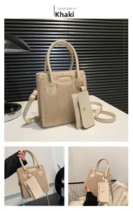 Detail of khaki plush tote bag with leather texture handles and removable zipper pouch
