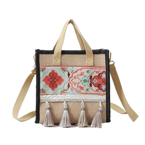 Ethnic embroidered jute tote bag with floral patterns and tassels for women