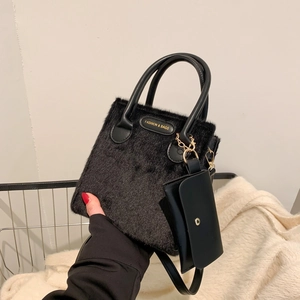 Fashionable black faux fur quilted tote bag with a small matching pouch and crossbody strap