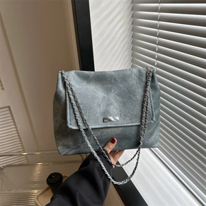 Blue-grey textured shoulder bag with silver chain strap and marble metal buckle