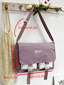 Detail of purple canvas messenger bag with front white pockets and dimensions shown