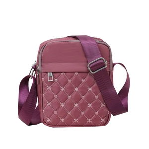 Minimalist purple quilted crossbody bag with adjustable wide shoulder strap for women