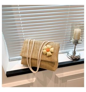 Detailed close-up of woven tote bag with wavy texture and white cotton rope handle