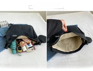 Macro detail of large canvas tote bag showing spacious interior with multiple daily essentials
