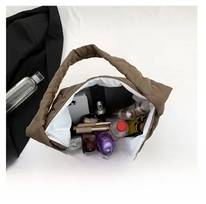 Top view of brown quilted cloud tote bag showing large interior capacity for daily essentials