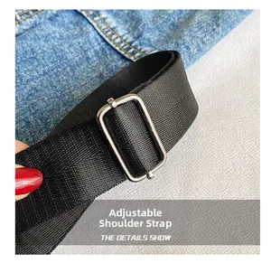 Détail de la bandoulière réglable en nylon avec boucle métallique argentée sur le cabas