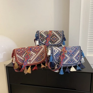Set of three bohemian ethnic style crossbody bags with embroidery and colorful tassels