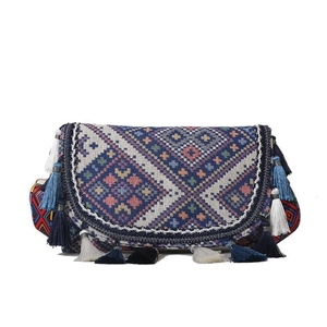 Bohemian style crossbody bag with colorful geometric woven pattern and fringe tassels