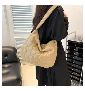 Detail of khaki quilted tote bag showing large capacity and comfortable wide shoulder straps