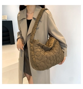 Coffee brown quilted tote bag with floral stitching detail and wide shoulder strap