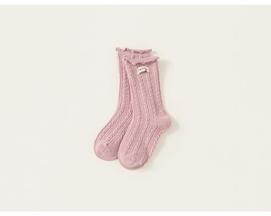 Detailed knit texture and lace cuffs on pink cotton girls' socks with small patch detail