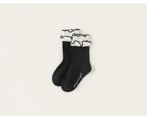 Detail of girls cotton knee high socks with white ruffle trim and elegance girl text