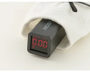 Detail showing fluorescence detector displaying zero reading on black cotton socks