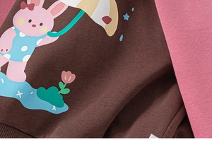 Close-up of cute rabbit silk screen print on brown and pink cotton kids sweatshirt