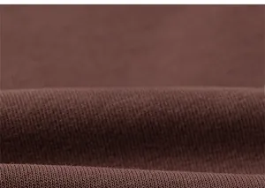 Detailed macro view of soft dark brown knit fabric texture for children sweatshirt