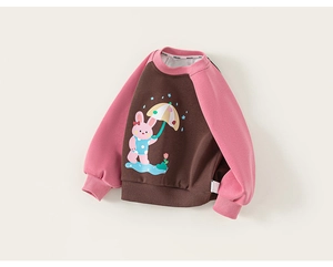 Close-up of kids' raglan sweatshirt with pink rabbit print and ribbed cuffs