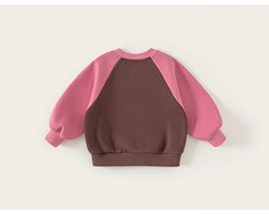 Detailed back view of a kids' raglan sweatshirt with pink sleeves and brown body fabric