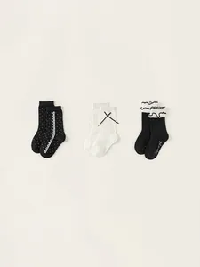 Three-pack girls' mid-calf cotton socks set with lace, bows, and elegant ruffles
