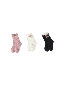 Three-pack girls knee-high socks with bows and polka dots on white background