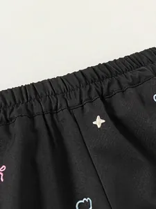 Pantalon cargo noir pour fille avec taille élastique et broderies d'étoiles