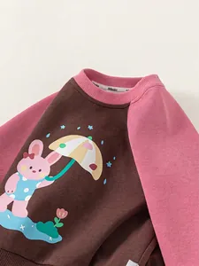 Kids long sleeve raglan sweatshirt featuring cute cartoon rabbit print in brown and pink