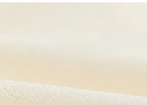 Close-up of soft cream-colored knitted fabric texture showing fine weave and premium quality