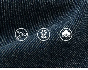 Detailed macro view showing soft twill weave texture of deep blue boys denim fabric