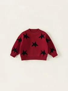 Classic red knitted sweater for boys featuring black star patterns and ribbed cuffs
