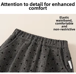Detail of high-elastic waistband on girls' grey heart print pants with soft fabric