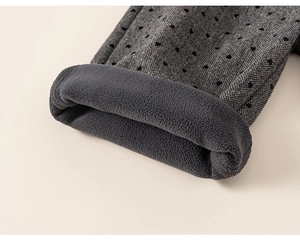 Macro detail of girls winter polka dot trousers with thick warm fleece lining texture