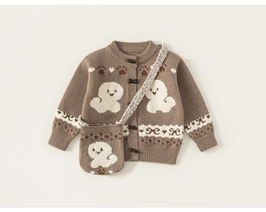 Detail of baby knit cardigan featuring toggle buttons and matching cartoon crossbody bag