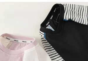 Detailed view of striped raglan sleeves and soft neckline on kids cotton t-shirts