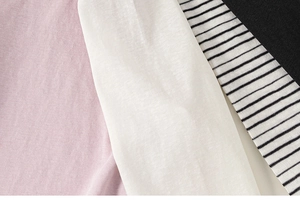 Close-up of soft cotton knit fabrics in pink, white, black and classic striped patterns
