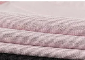 Close-up of soft striped knit fabric in pink and black for children long sleeve t-shirt