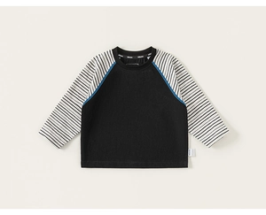 Detail of kids striped raglan sleeve shirt with blue decorative stitching on shoulder