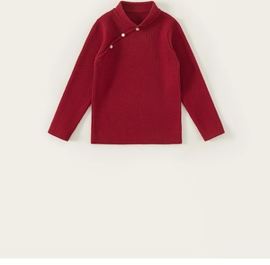 Detailed macro shot of dark red ribbed knit sweater with elegant pearl button closure