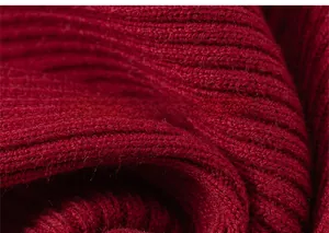 Macro view of dark red ribbed knit fabric texture on the girls long sleeve sweater