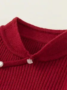Red knit sweater for girls with vertical ribbed texture and pearl button collar detail