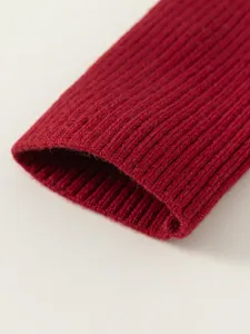 Classic red ribbed knit sweater sleeve detail for girls with soft elastic texture