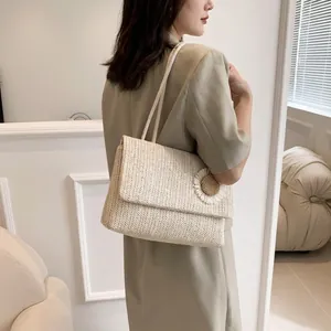 French country style straw woven crossbody bag with side daisy detail and thin strap