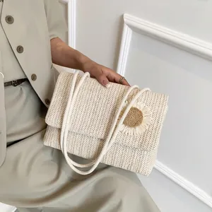 Straw woven crossbody bag with sunflower detail and thick rope strap in cream white