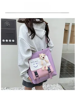 Outdoor shot of a purple contrast canvas tote with a teddy bear and Hello Baby print