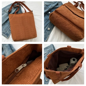 Detail view of corduroy tote bag features caramel brown texture and outer pocket detail