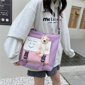 Contrast color canvas tote bag with purple pink panels and cute bear charm for students