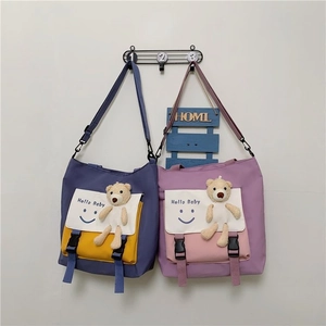 Contrast color canvas tote bag with smiley print and cute plush bear charm for students