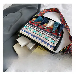 Internal view of ethnic style bag showing storage for phone, cream and cosmetics