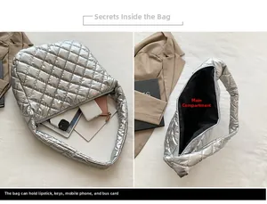 Detailed interior of silver quilted puffer tote bag showing spacious main compartment space