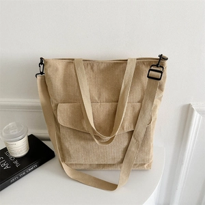 Large khaki corduroy tote bag with front pocket and adjustable shoulder strap for women