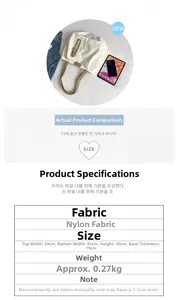 Detailed view of white nylon tote bag with brown handles and front zip pocket