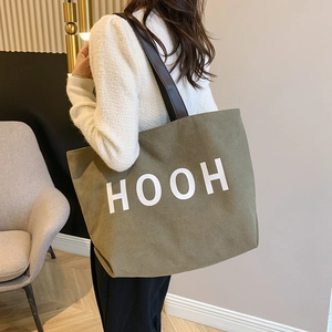 Sac cabas en toile vert olive avec texte HOOH blanc et anses en cuir marron